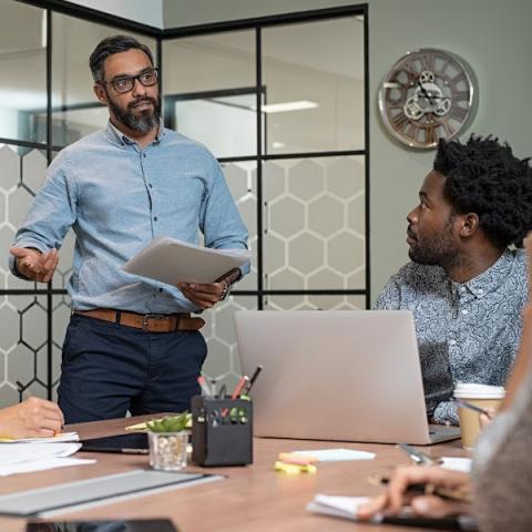 Professor teaching diverse adult students in c;lassroom