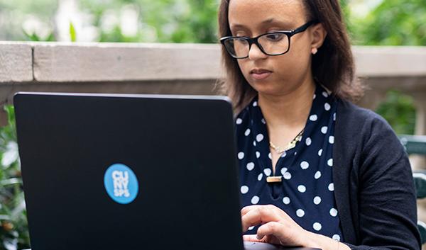 CUNY SPS online adult student working on a project for class
