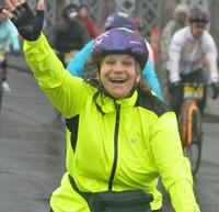 Angie riding a bike in a bike race